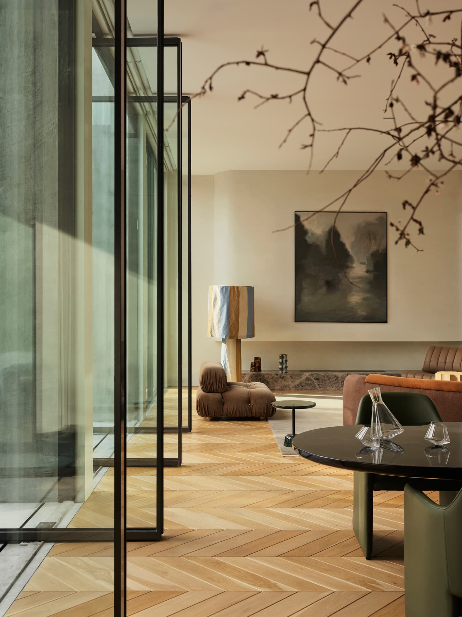Artisan House — glass wall and branches