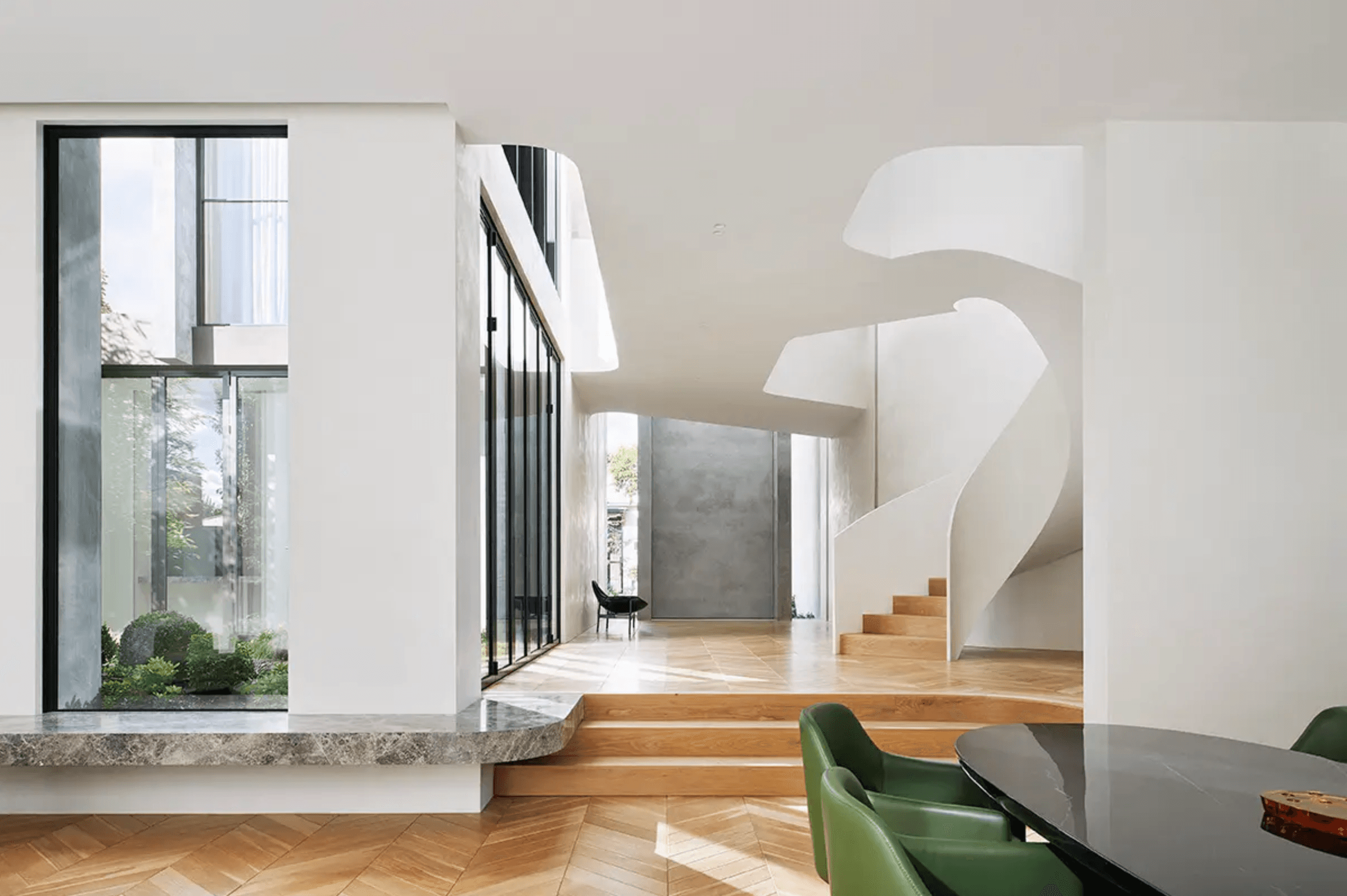 Artisan House — staircase and green chairs